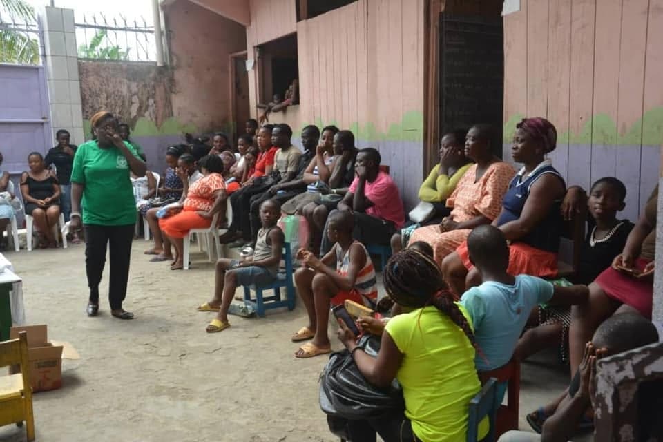 Women and children from the community gathered together during a Be Real Humanitarian Works outreach